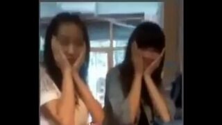 Chinese girl’s skirt flipped by her friend